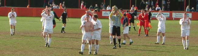 City players applaud the travelling faithful.