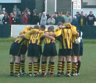 in a huddle at Merthyr