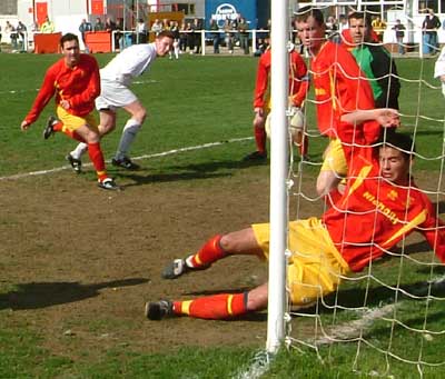 Tomkins header hits the post.