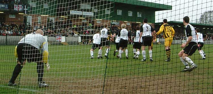 City free kick charged down.